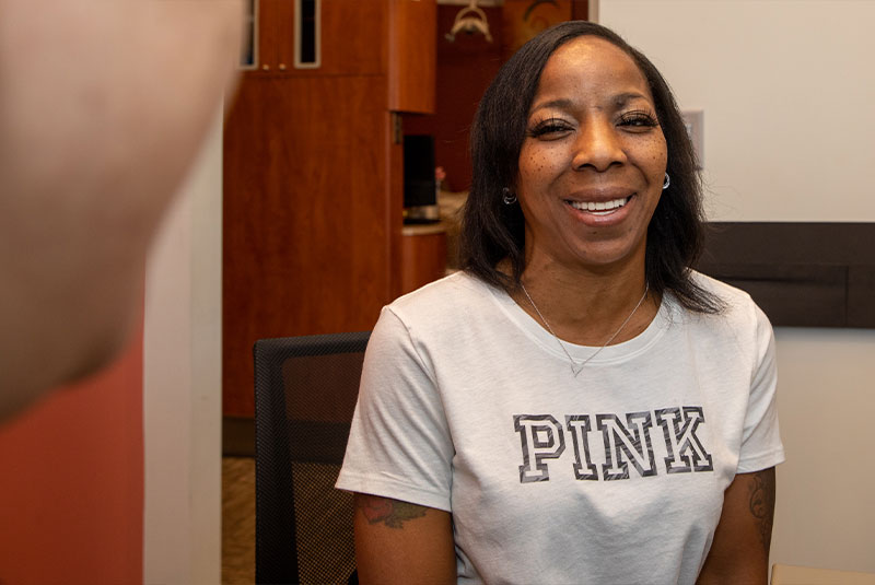patient smiling and going over dental procedure information